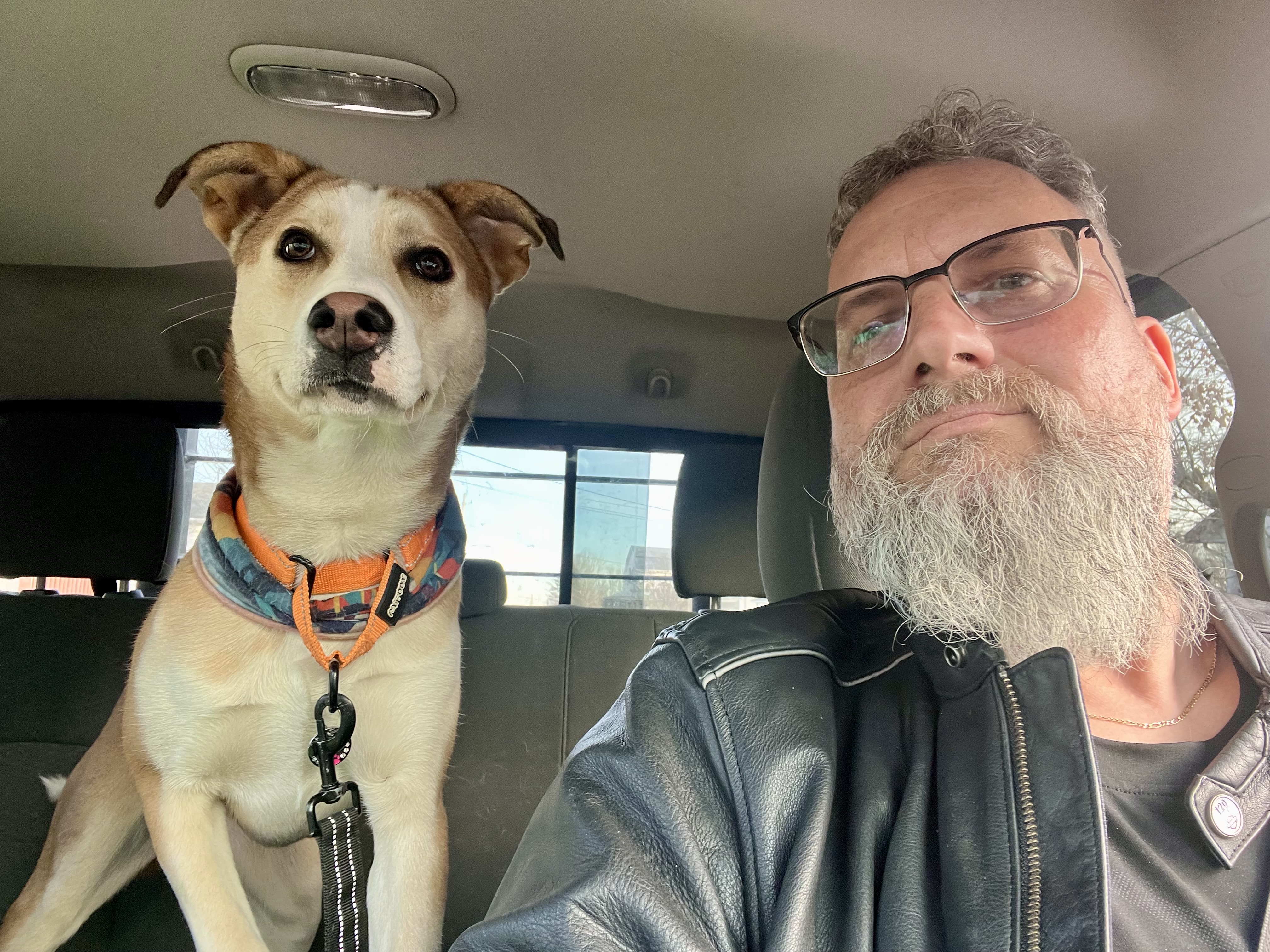 Karell with a dog in a truck